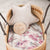 A bassinet with a star pillow, and a sign that says Us + You = Love on top of our Hastings sheet. 