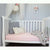 A cot with our Duchess fitted sheet on it. 