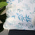 A close up picture of a corner of a pillow case with our Eton pattern on it. 